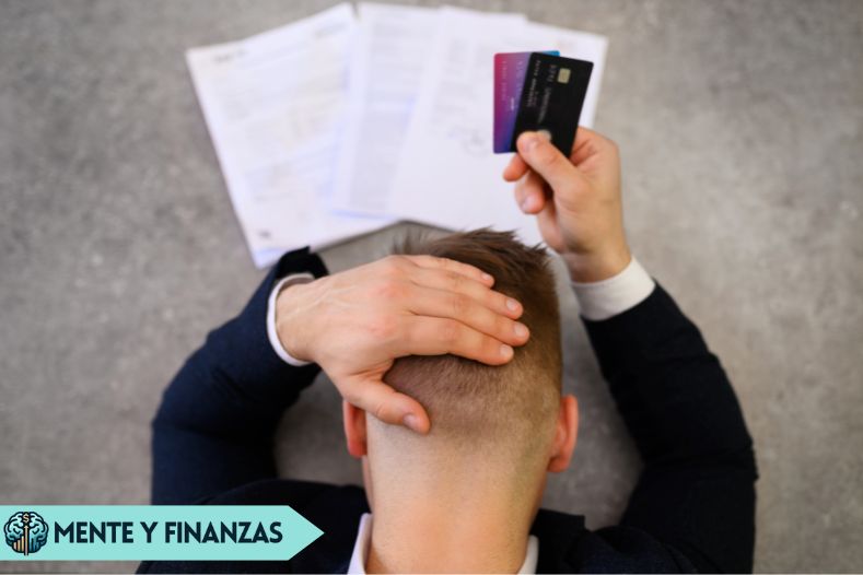 Hombre revisando sus finanzas con preocupación, rodeado de gráficos y cuentas, representando los errores financieros comunes en los 30s